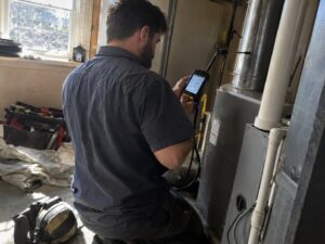 Combustion analysis reading at a furnace flue by Aegis Heating and Air