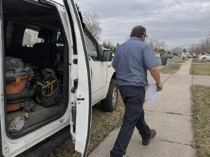 Technician arriving in a service area neighborhood in Kearns Ut by Aegis Heating and Air