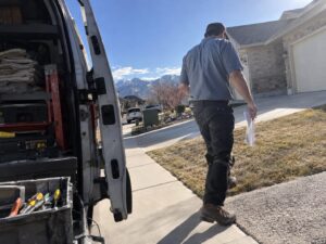 Technician arriving in a service area neighborhood in West Jordan Ut by Aegis Heating and Air
