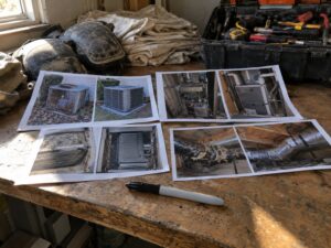 Preparing a before and after photo set on a shop office desk by Aegis Heating and Air