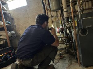 Inspecting a boiler circulator pump by Aegis Heating and Air