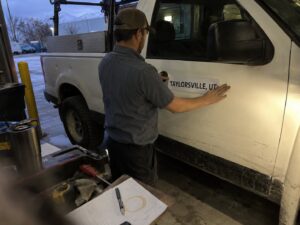 Applying a city name magnet before a service area job in Taylorsville Ut by Aegis Heating and Air