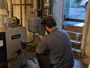 Testing boiler expansion tank pressure by Aegis Heating and Air