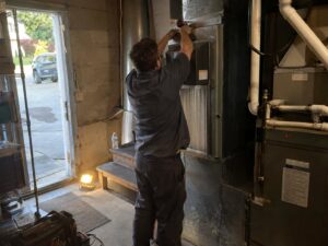 Installing a whole-home HEPA bypass air cleaner in Carbon Monoxide Testing by Aegis Heating and Air