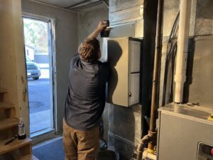Installing a whole-home HEPA bypass air cleaner in Uv Light Treatment by Aegis Heating and Air