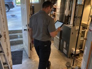 Residential HVAC maintenance walkthrough with a tablet checklist by Aegis Heating and Air