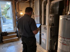 Residential HVAC maintenance walkthrough with a tablet checklist in Maintenance by Aegis Heating and Air