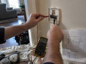 Checking thermostat wiring during a heating call in Heat Exchanger Repair by Aegis Heating and Air