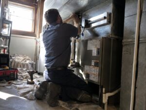 Installing a UV light in a supply plenum in Air Purifiers by Aegis Heating and Air