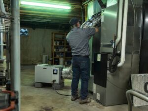 Installing a whole-home dehumidifier as part of an IAQ package in Humidifiers by Aegis Heating and Air